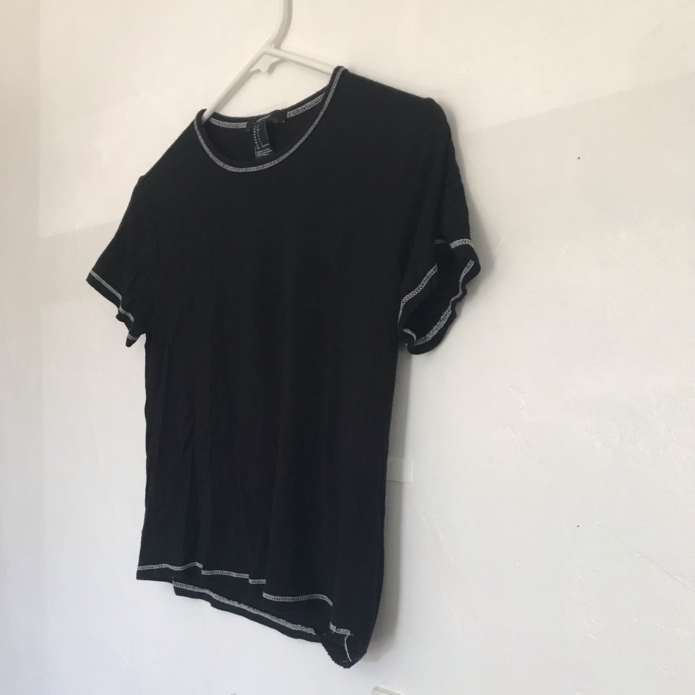 Plain black top with white threads